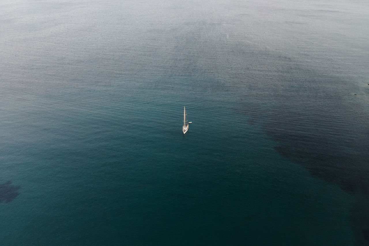 water, sea, nautical vessel, high angle view, ocean, transportation, horizon, mode of transportation, day, nature, beauty in nature, tranquility, scenics - nature, wave, waterfront, tranquil scene, coast, outdoors, travel, ship, aerial view, no people, vehicle, wake, reflection, sailing
