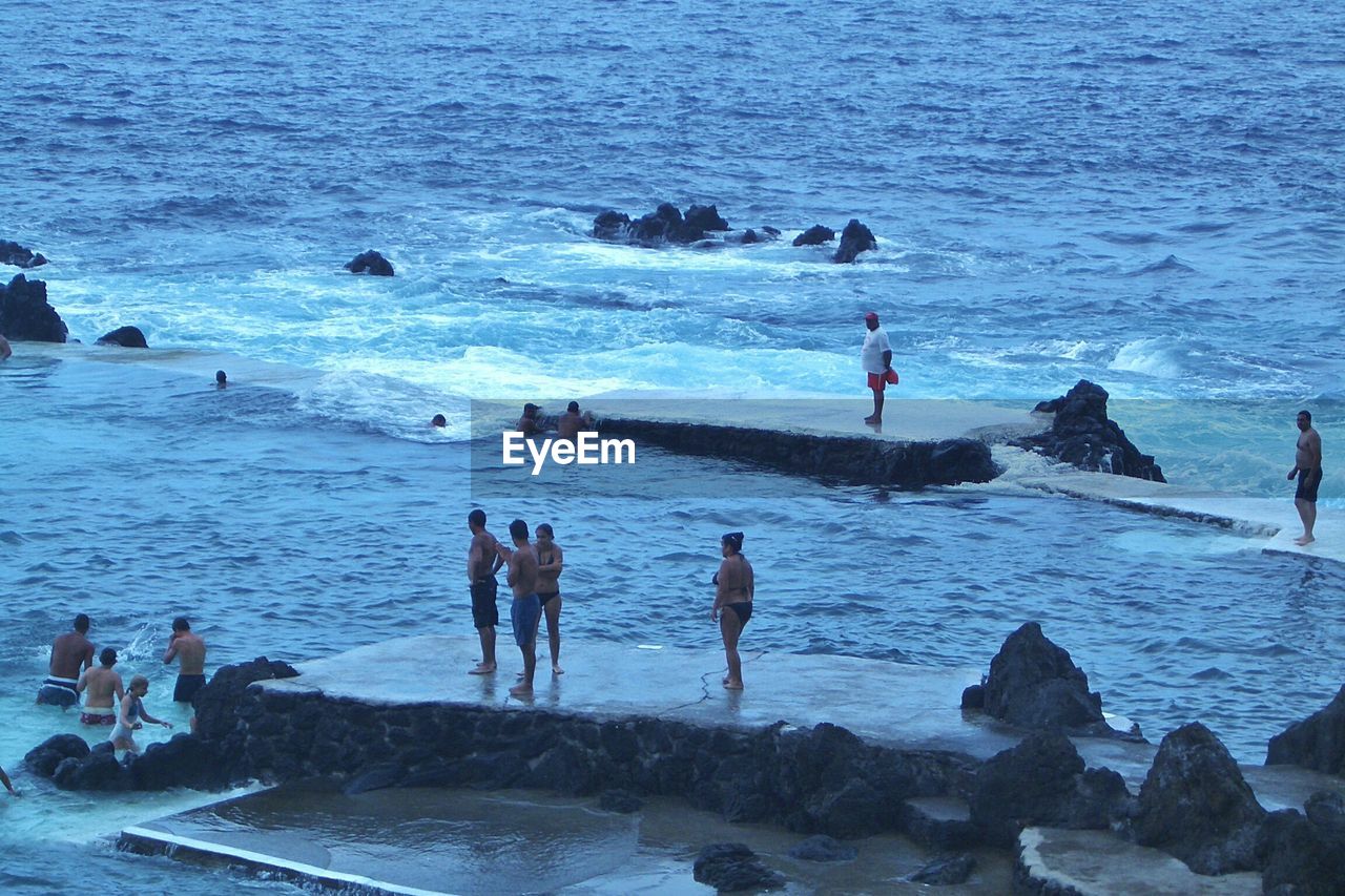 High angle view of people enjoying at sea