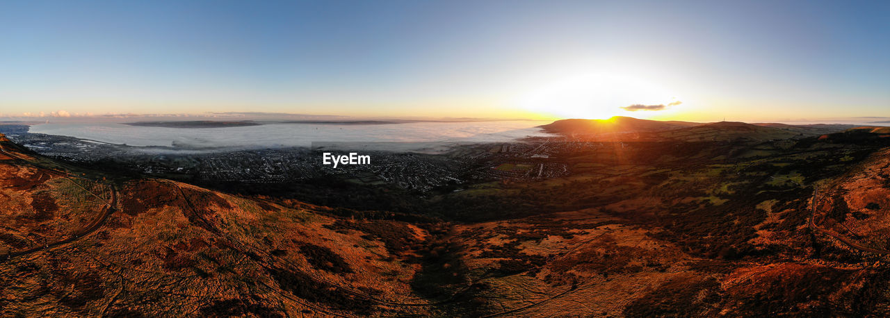 Scenic view of belfast, during low fog, against sky during sunset, taken from cavehill