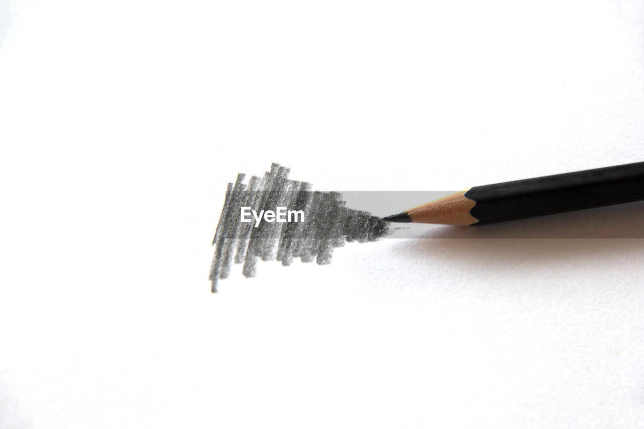 HIGH ANGLE VIEW OF PENCILS AND WHITE BACKGROUND