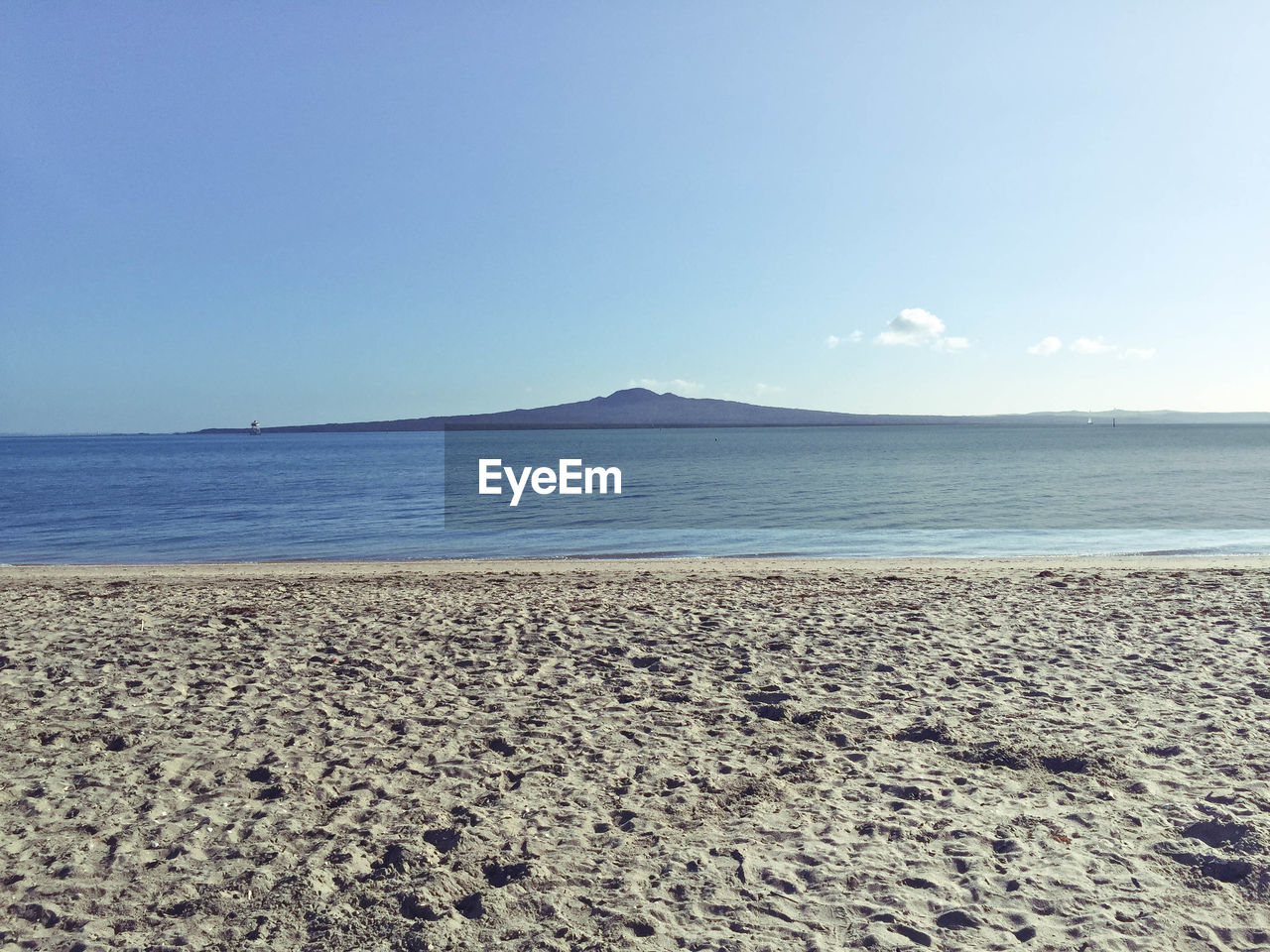 Scenic view of beach against clear sky