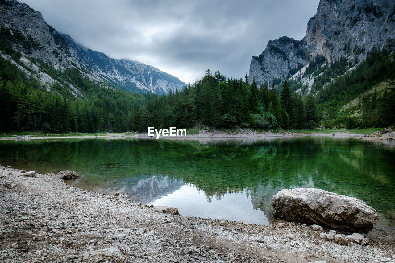 Scenic view of lake and mountains against sky