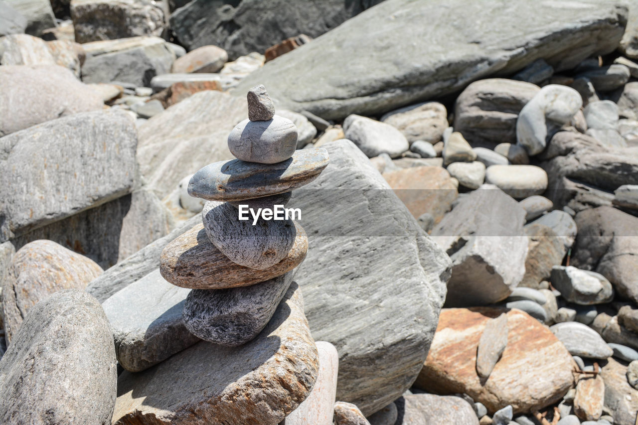 CLOSE-UP OF STONE STACK ON ROCKS