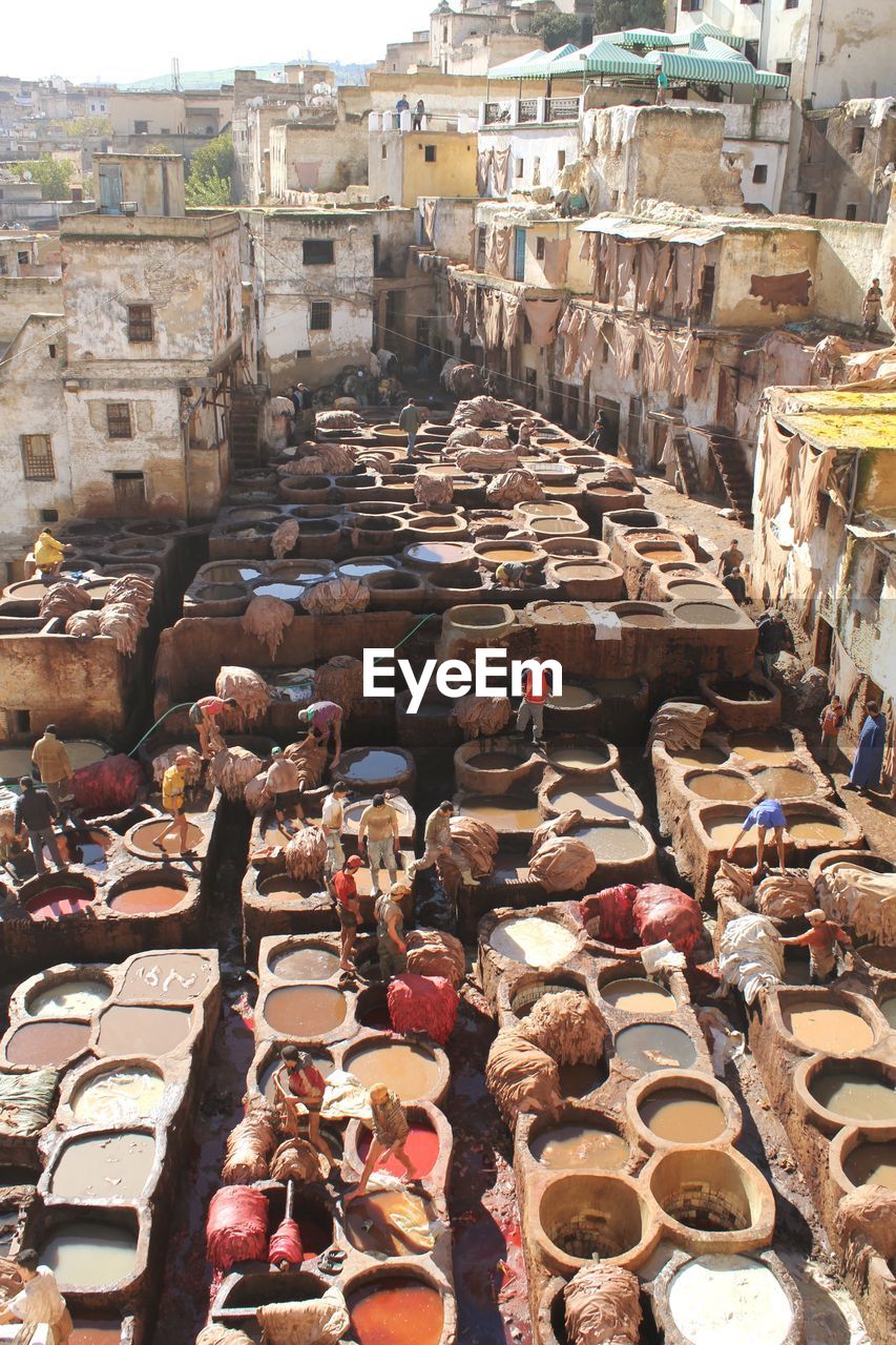 Workers tan leather in tanning pits