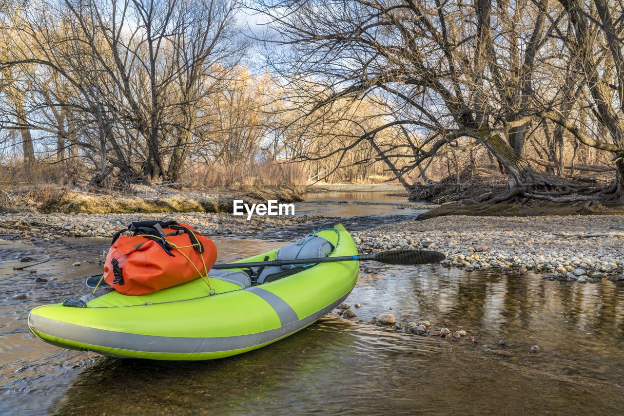 Kayak moored by river