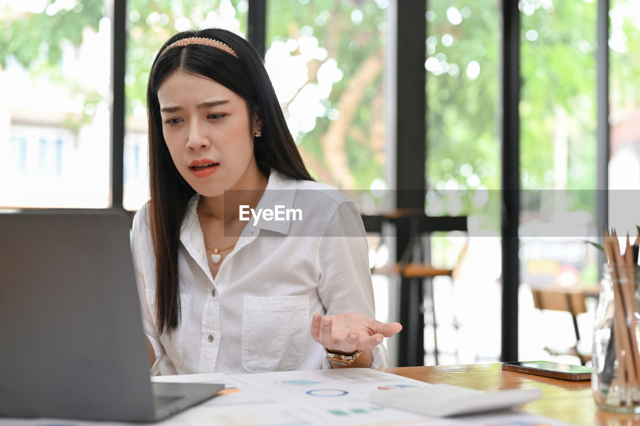 portrait of young businesswoman working at office