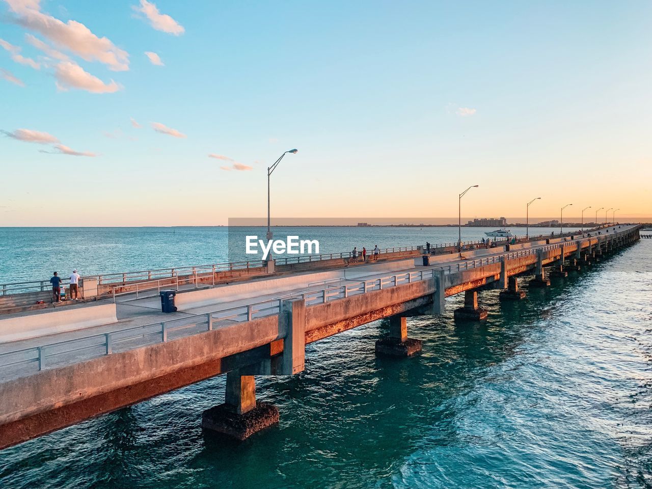 PIER OVER SEA DURING SUNSET