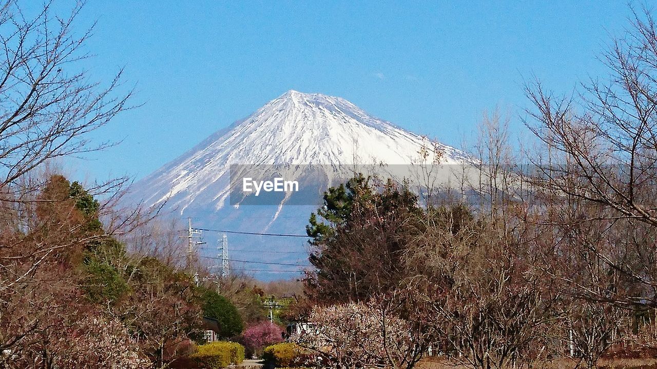 VIEW OF SNOWCAPPED MOUNTAINS AGAINST CLEAR BLUE SKY