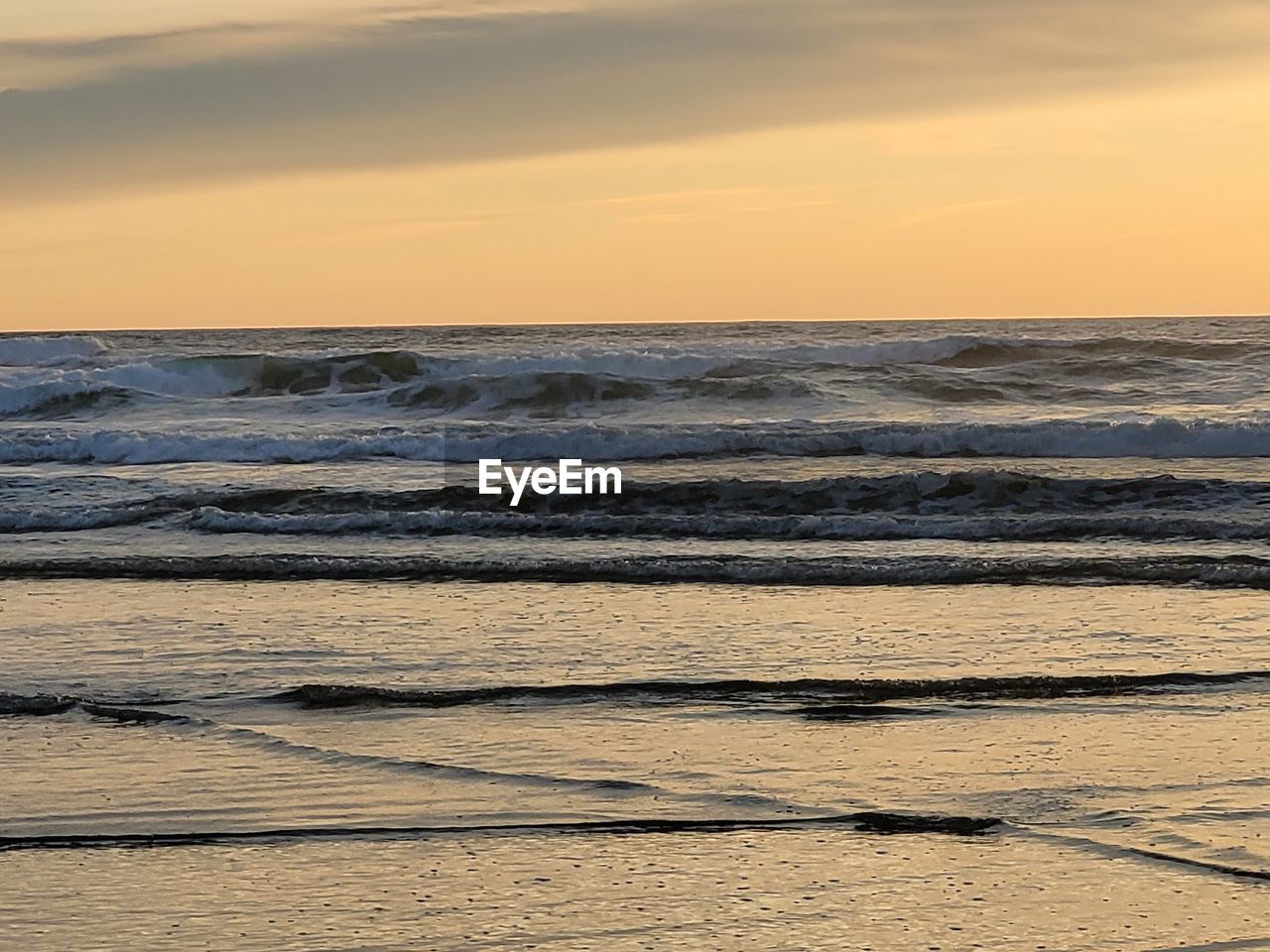 sea, sky, water, sunset, land, beauty in nature, scenics - nature, beach, sand, shore, nature, horizon, horizon over water, tranquility, body of water, wave, ocean, tranquil scene, motion, wind wave, coast, no people, cloud, idyllic, orange color, outdoors, sunlight, non-urban scene, dramatic sky, environment, dawn, sports, wood