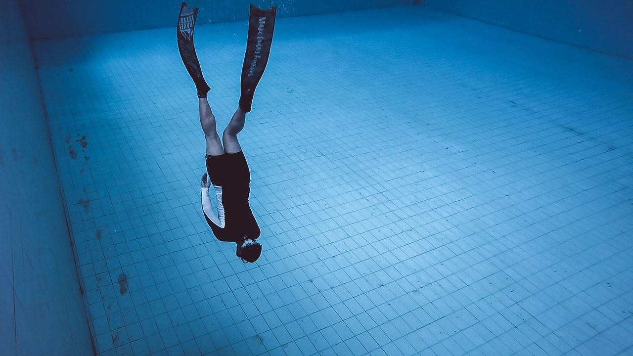 High angle view of man swimming in pool