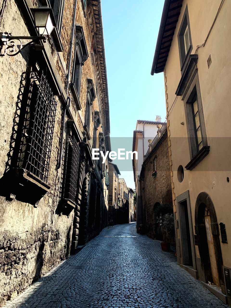 NARROW ALLEY AMIDST BUILDINGS