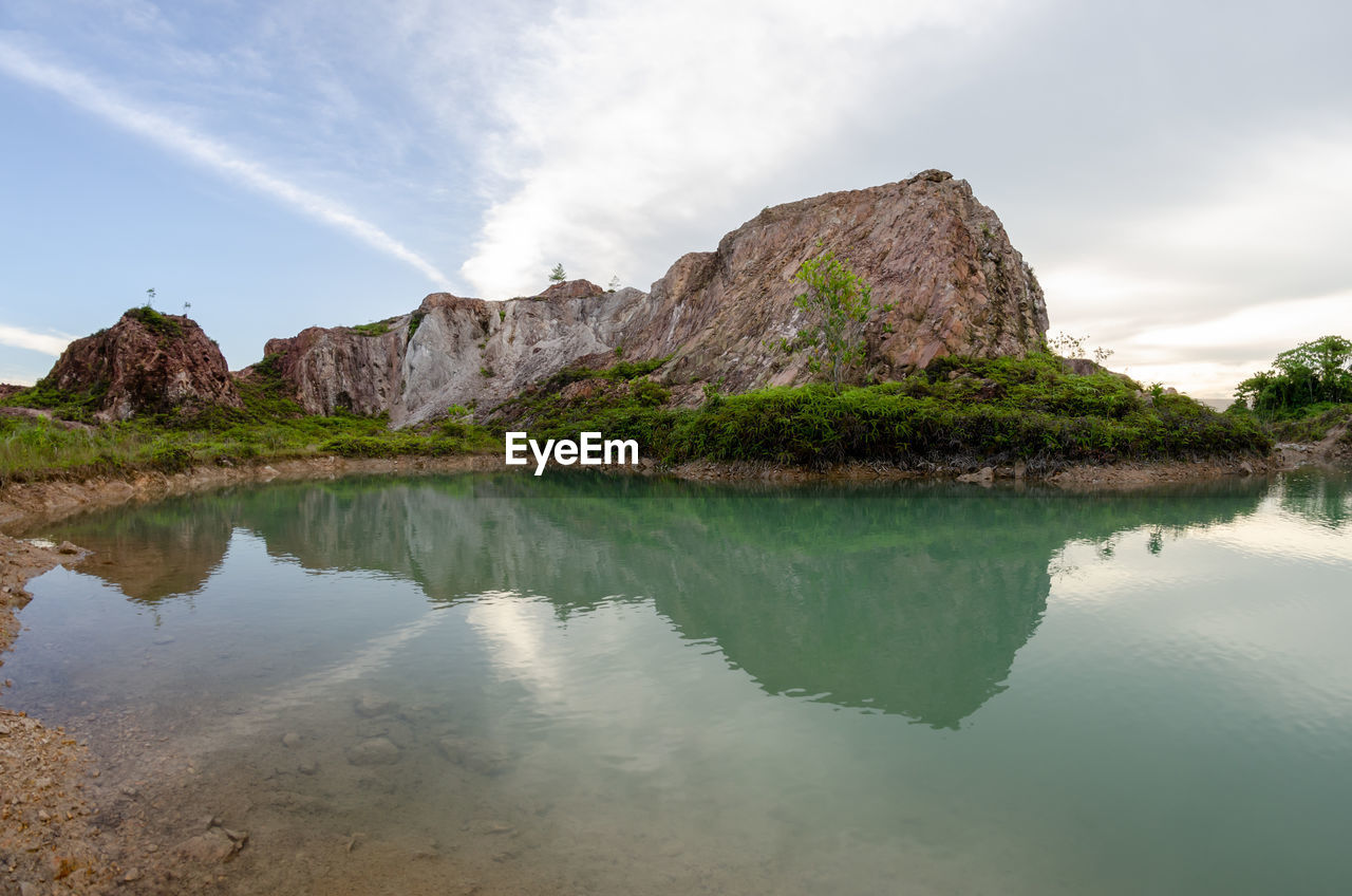 water, sky, scenics - nature, reflection, beauty in nature, rock, environment, nature, cloud, land, mountain, landscape, travel destinations, lake, tranquility, travel, beach, body of water, no people, tranquil scene, rock formation, tourism, non-urban scene, outdoors, coast, tree, cliff, plant, trip, terrain, shore, lagoon, animal wildlife, mountain range, vacation, holiday, reservoir, day, idyllic, bay