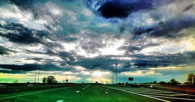 VIEW OF ROAD AGAINST CLOUDY SKY