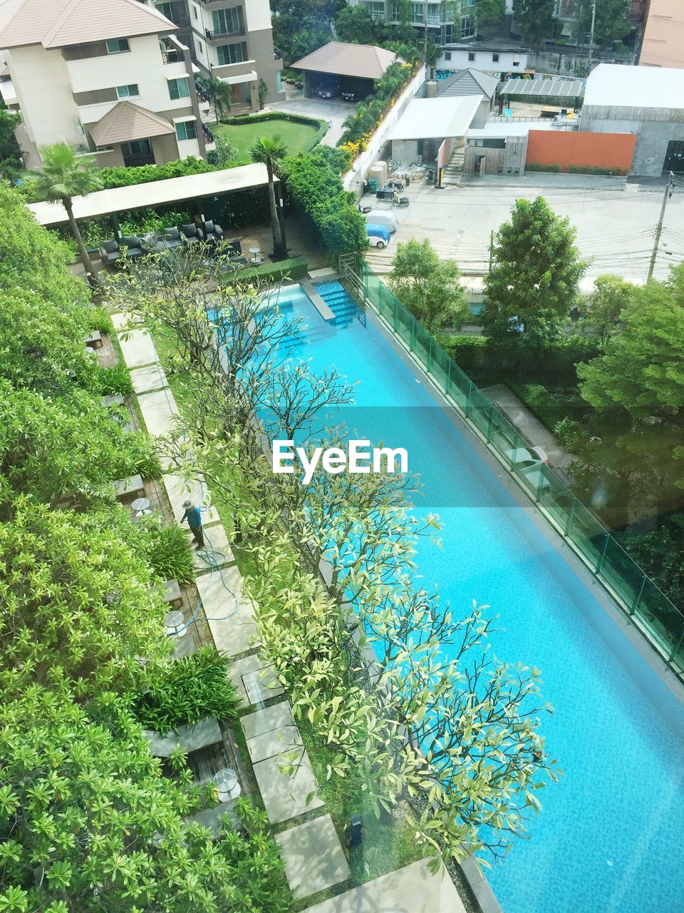 HIGH ANGLE VIEW OF SWIMMING POOL IN PARK