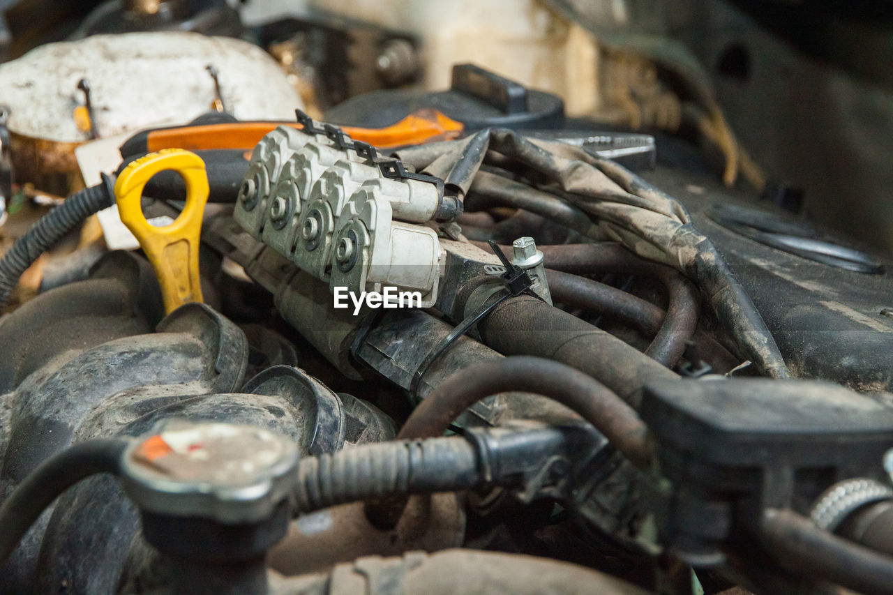 Diagnostics and repair of the car engine in the repair service. car service business concept