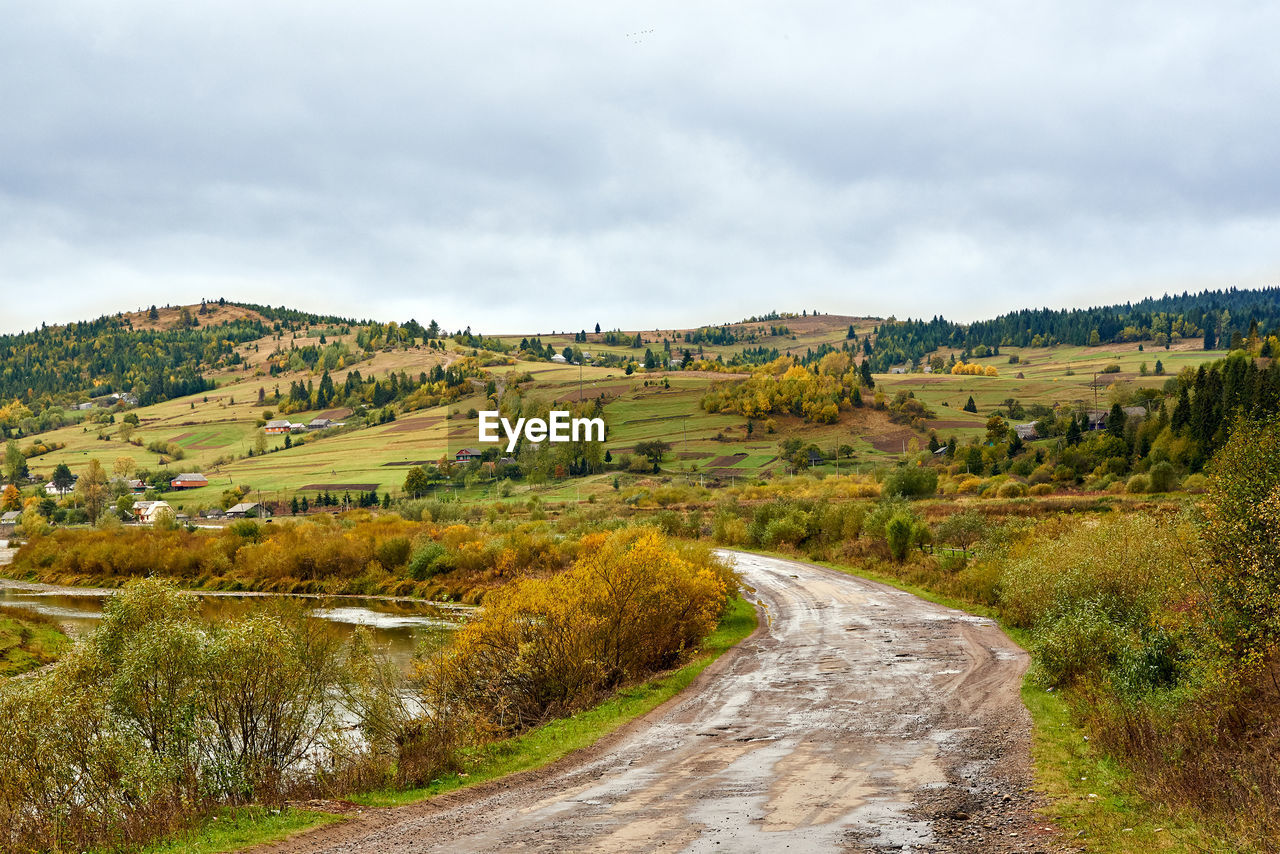 View of dirt road through landscape