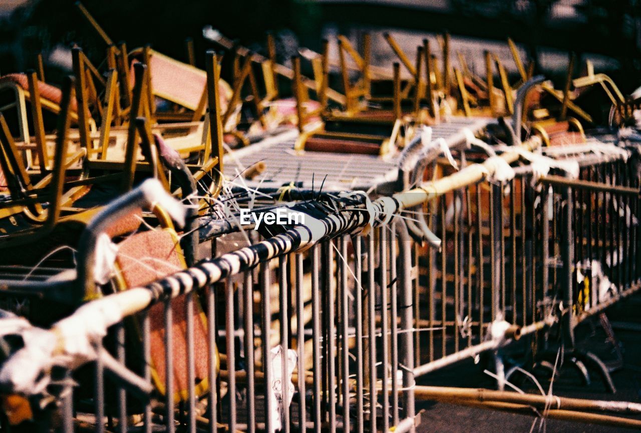 Upside down chairs by railings