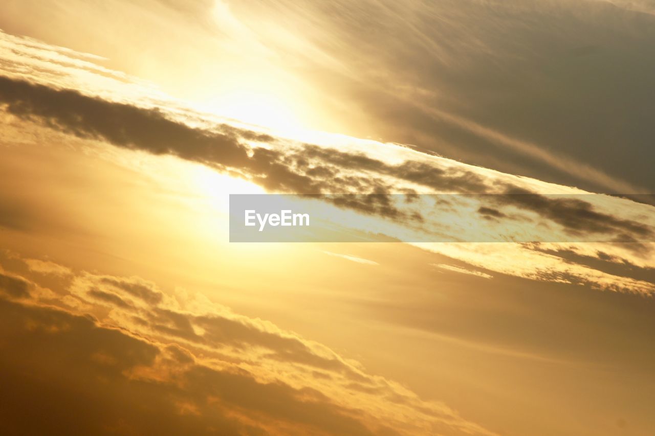 LOW ANGLE VIEW OF CLOUDSCAPE DURING SUNSET