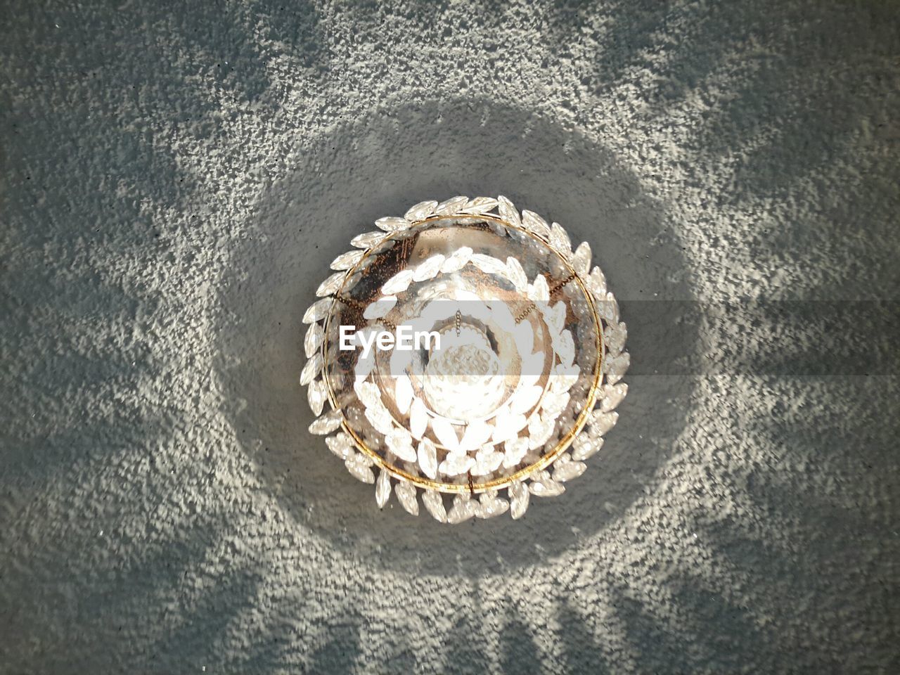 Low angle view of illuminated chandelier indoors