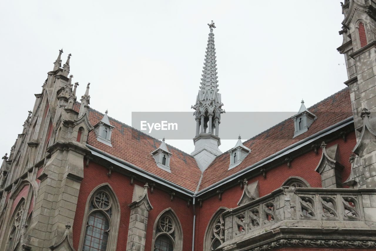 HIGH SECTION OF HISTORIC CHURCH AGAINST CLEAR SKY