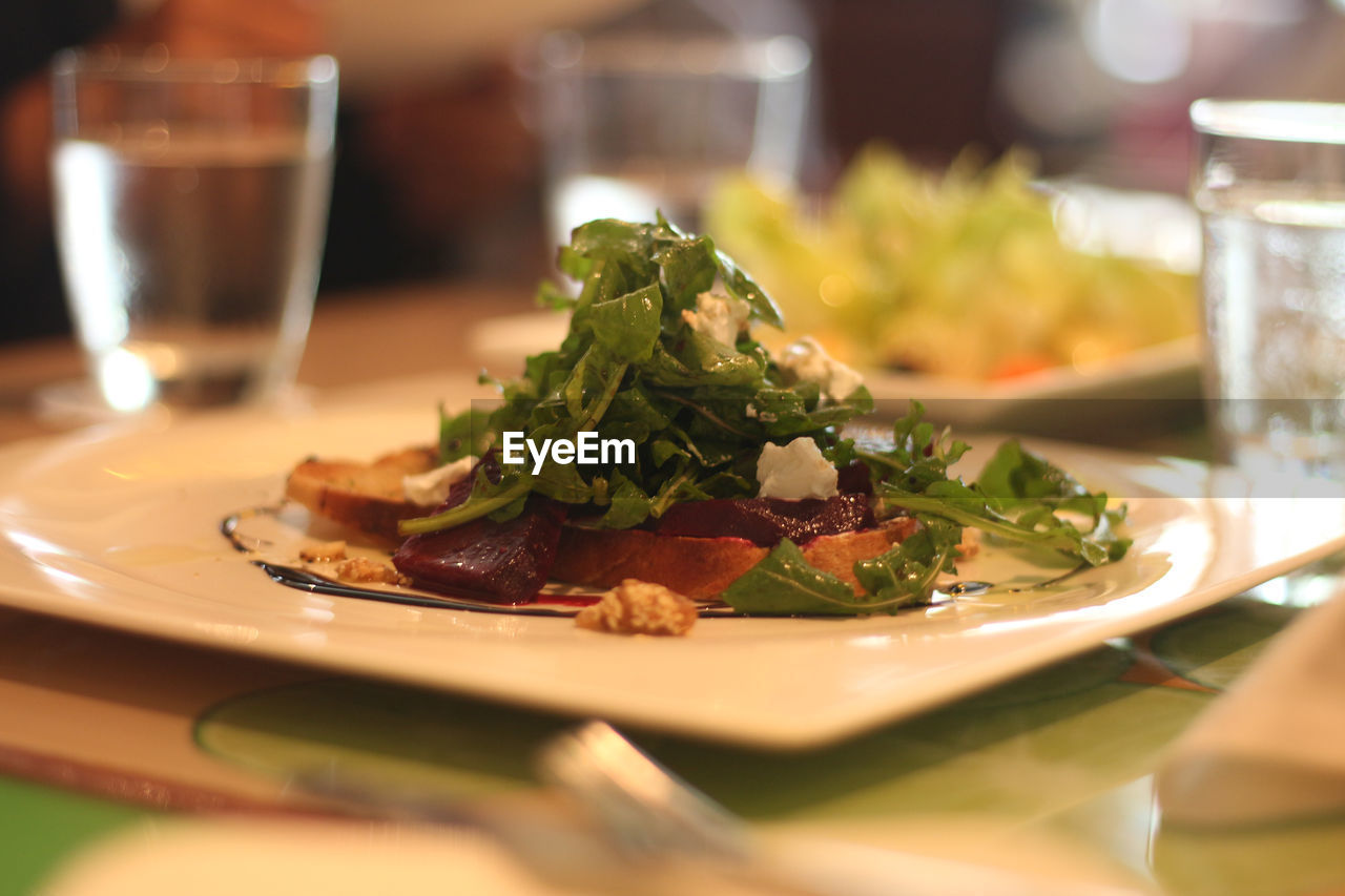 CLOSE-UP OF SERVED MEAT IN PLATE