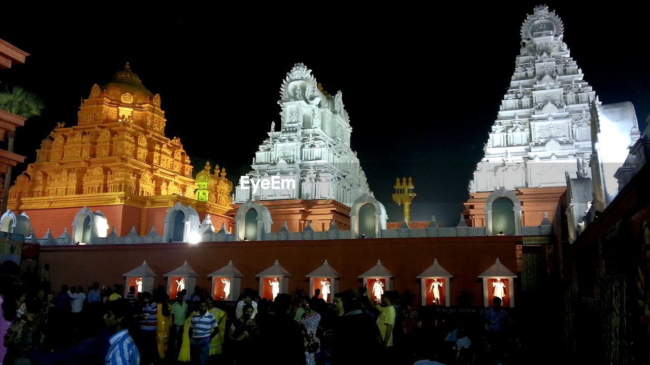 People by venkateswara temple at night