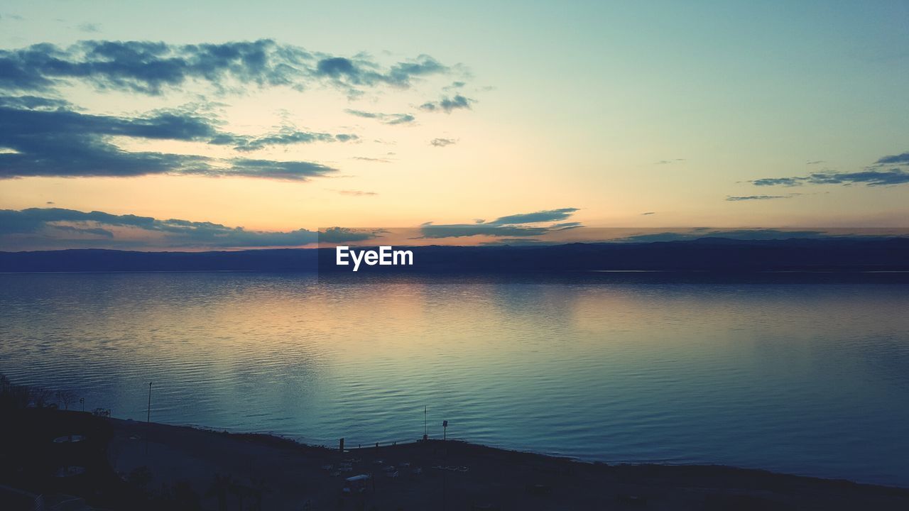 LAKE AGAINST SKY DURING SUNSET