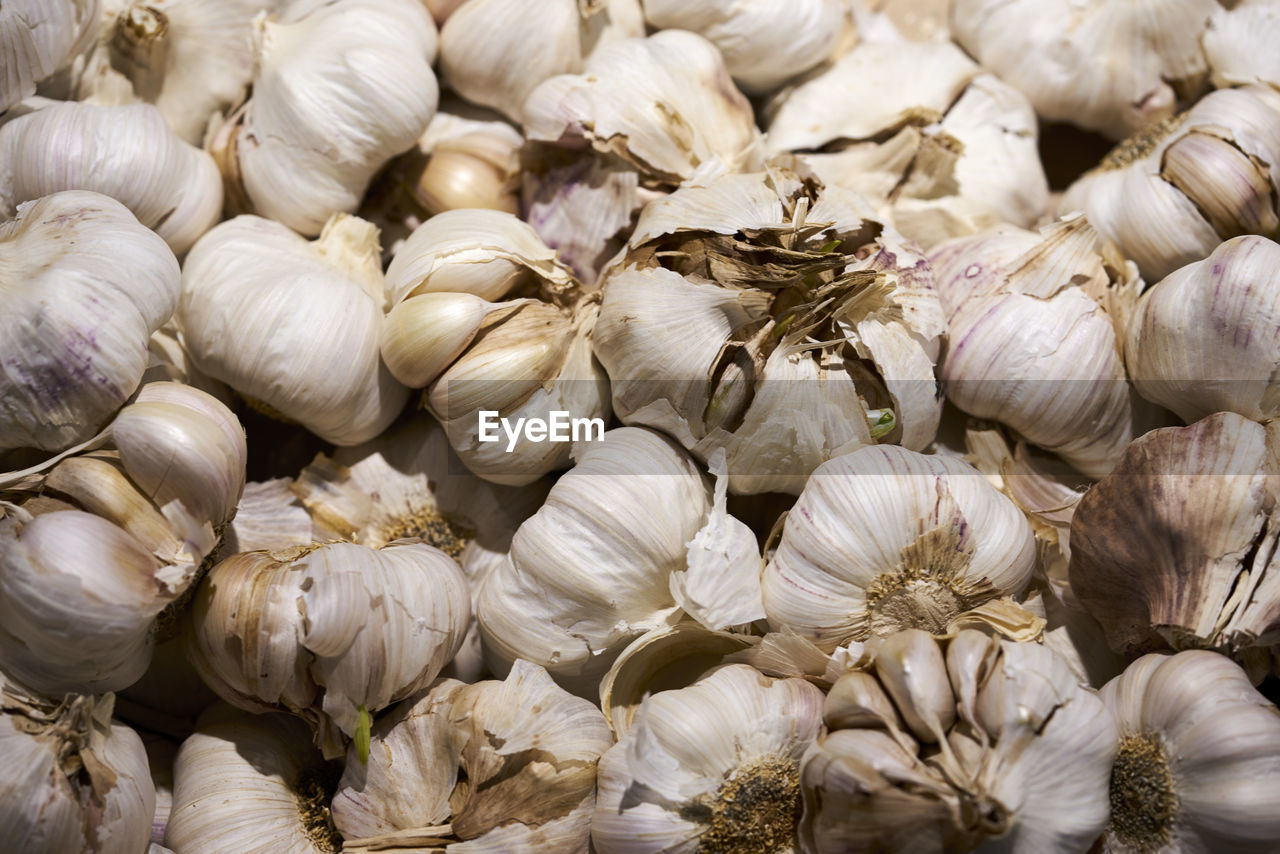 Full frame shot of garlics for sale at market stall