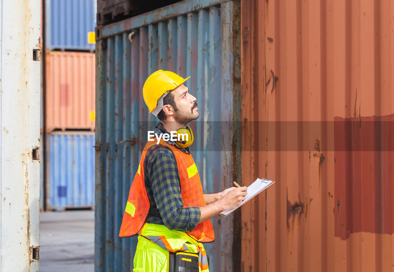 MAN WORKING WITH MOBILE PHONE