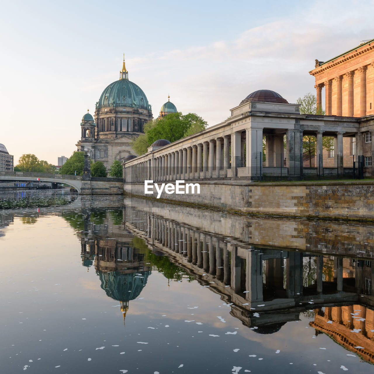 Reflection of berliner dom by spree river against sky