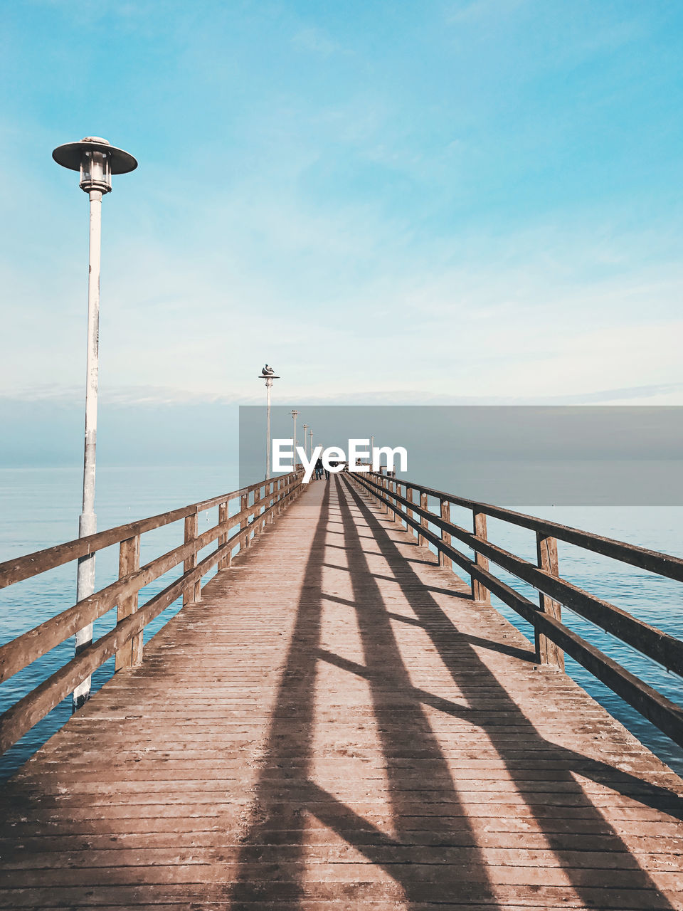 Pier over sea against sky