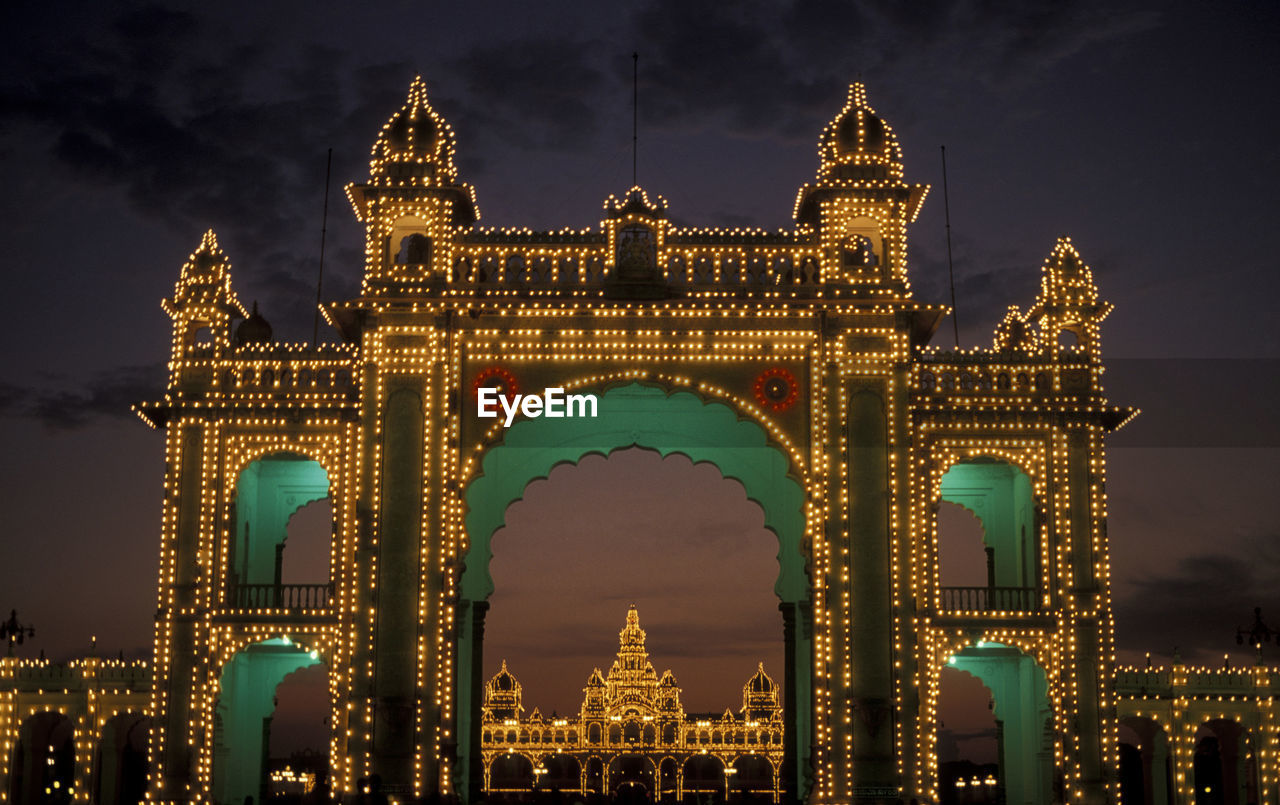 Illuminated entrance gate of mysore palace at night