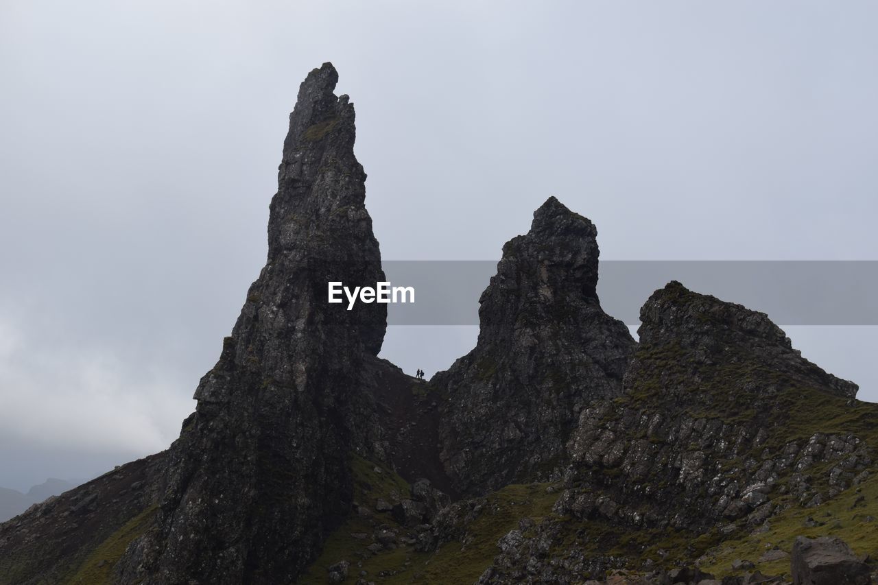 Low angle view of rock formation against sky