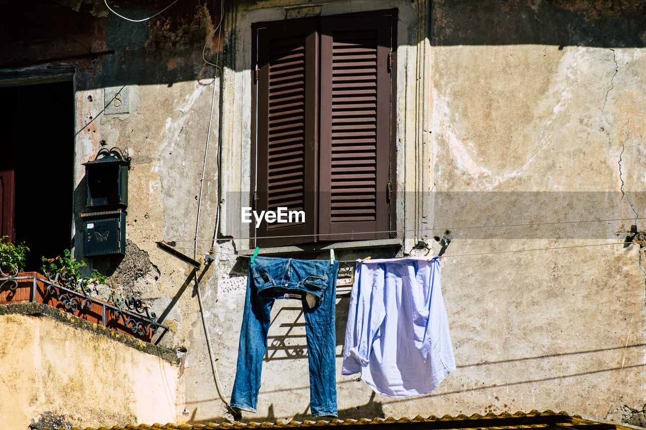 CLOTHES DRYING OUTSIDE BUILDING