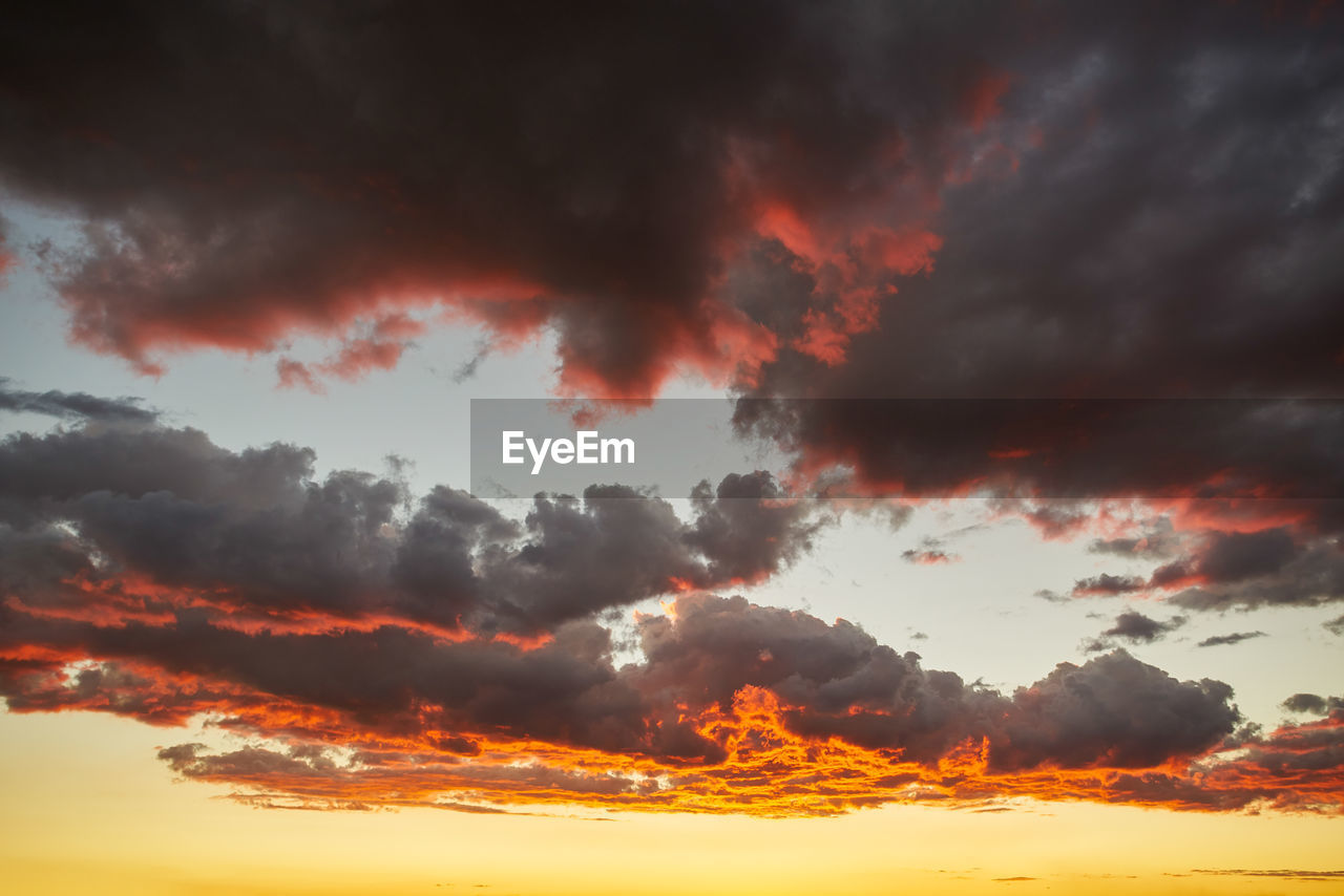 LOW ANGLE VIEW OF DRAMATIC SKY OVER CLOUDS DURING SUNSET