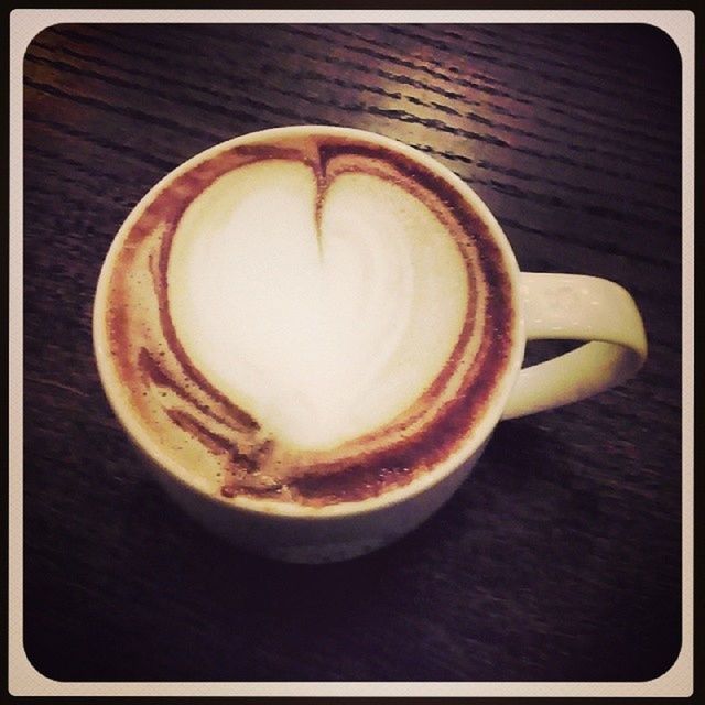 CLOSE-UP OF COFFEE CUP ON TABLE