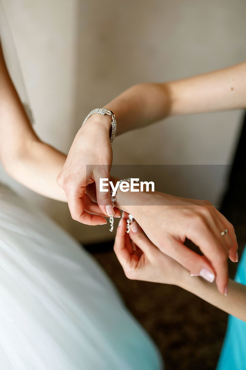 Cropped hand of woman with nail polish