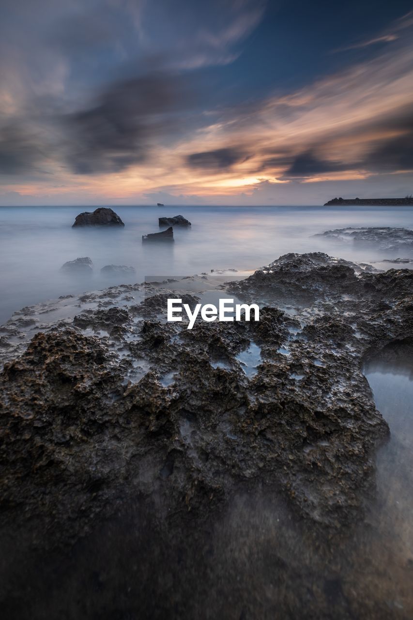 Scenic view of sea against sky during sunset