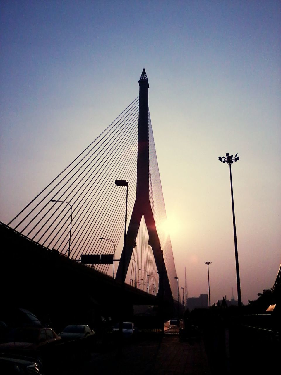 SUSPENSION BRIDGE AT SUNSET