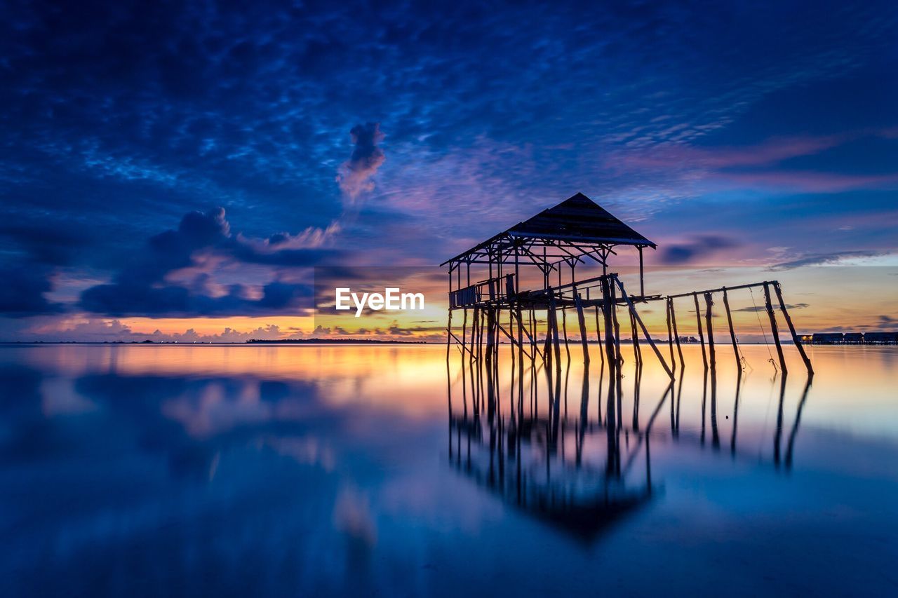 Scenic view of sea against sky at sunset