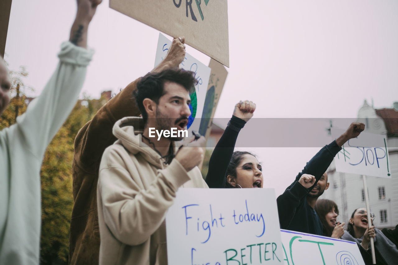 Male and female activist screaming in social movement