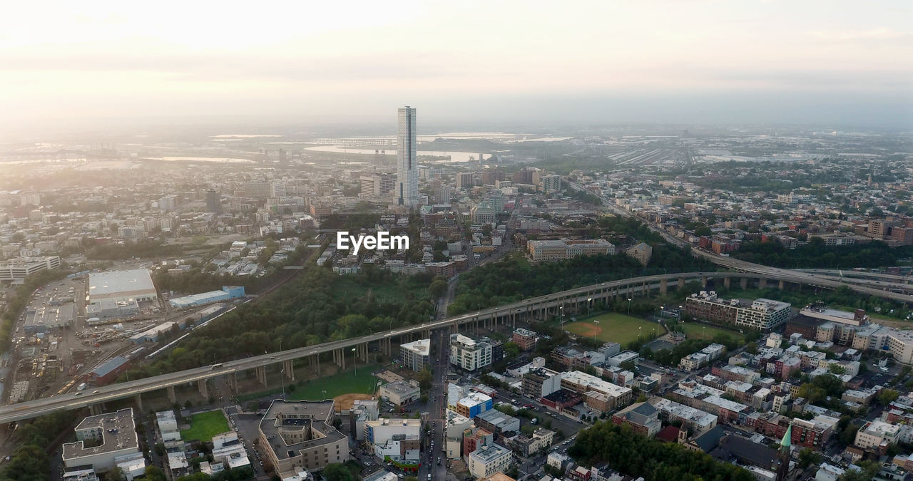 High angle view of city buildings against sky