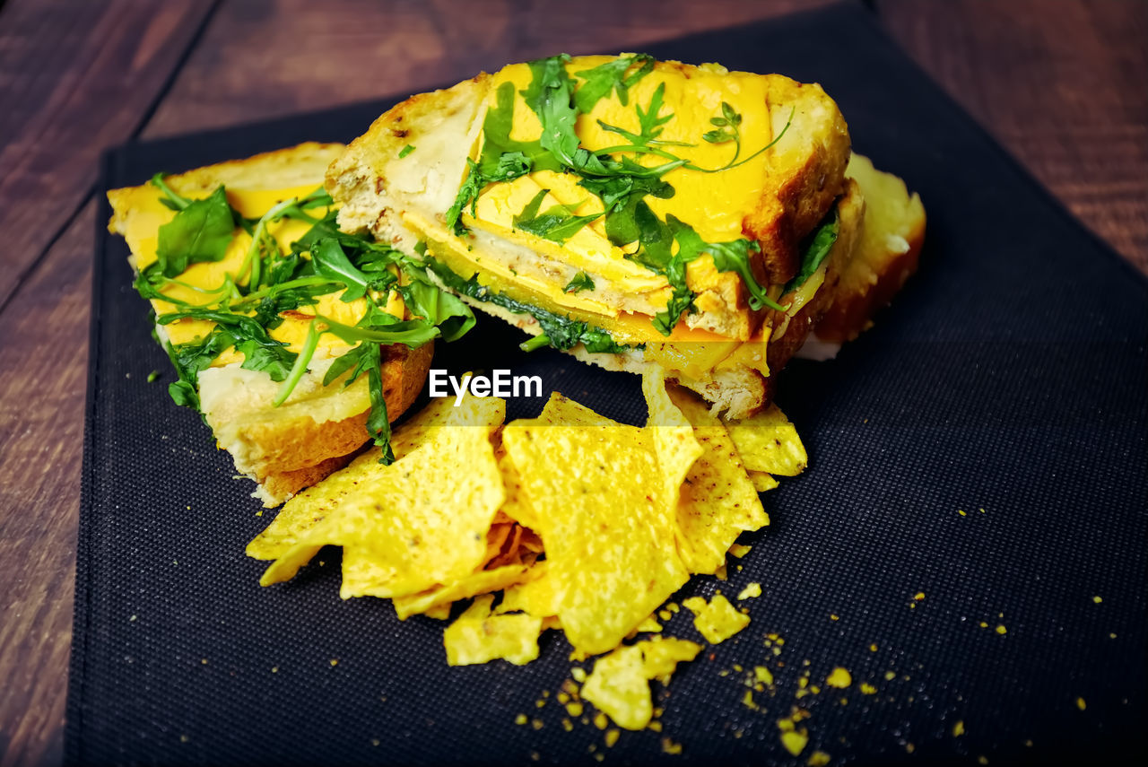 food, food and drink, yellow, freshness, healthy eating, wellbeing, fast food, dish, vegetable, produce, indoors, no people, wood, meal, leaf, high angle view, close-up, table, still life, cuisine, vegetarian food, herb