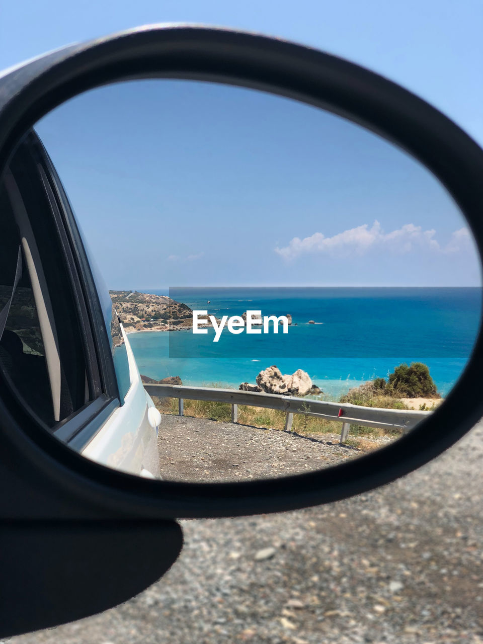 SCENIC VIEW OF SEA SEEN THROUGH WINDSHIELD