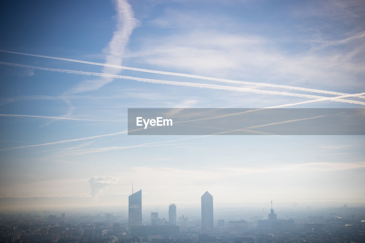 Aerial view of modern buildings in city against sky, lyon