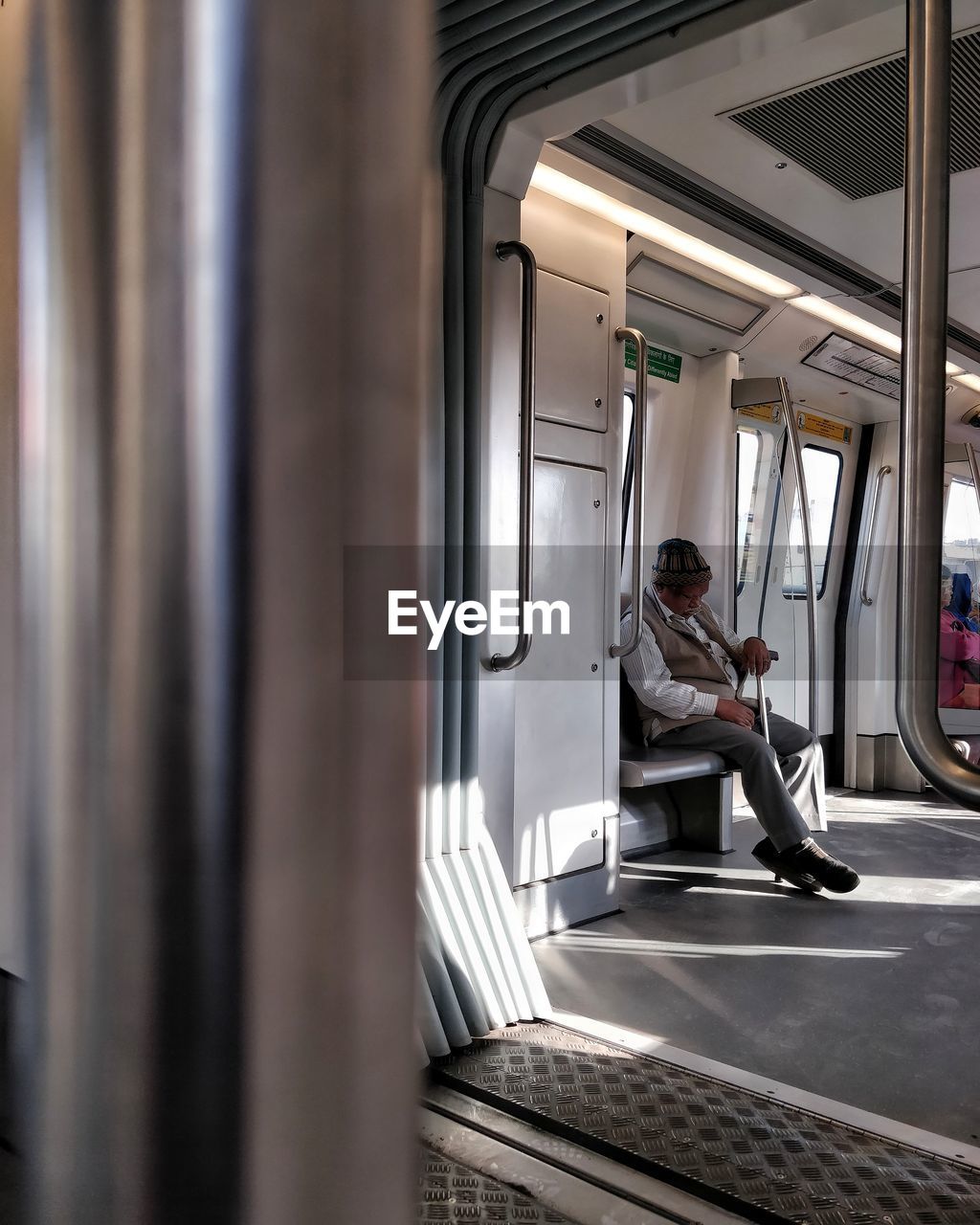 MAN SITTING AT TRAIN