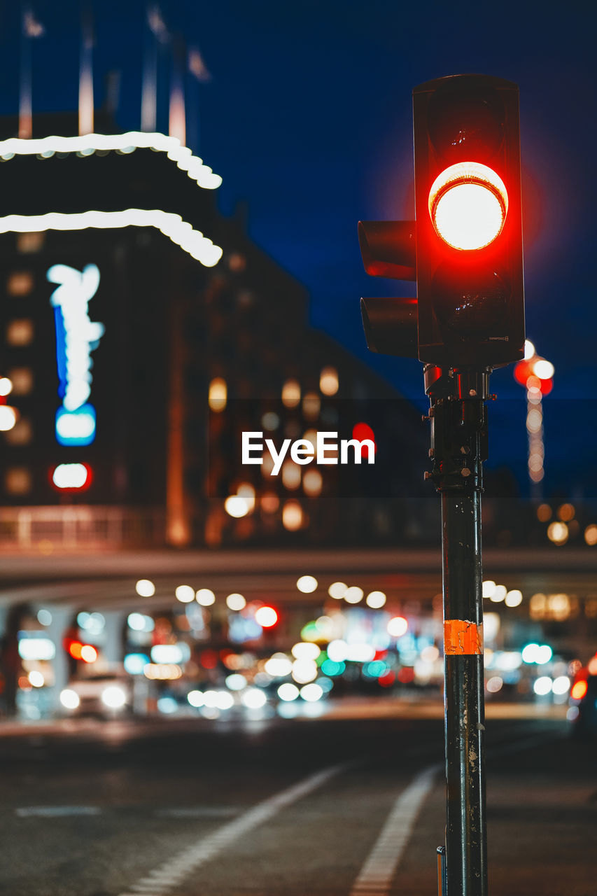 Illuminated signal on road at night