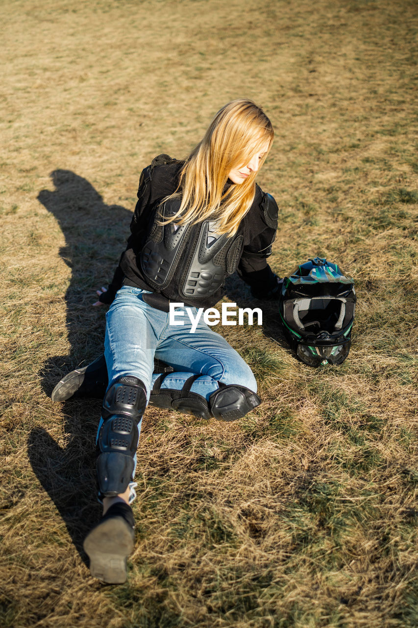 Woman motocross rider resting