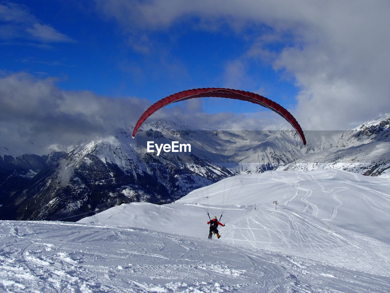 Tourists enjoying on snow covered mountain