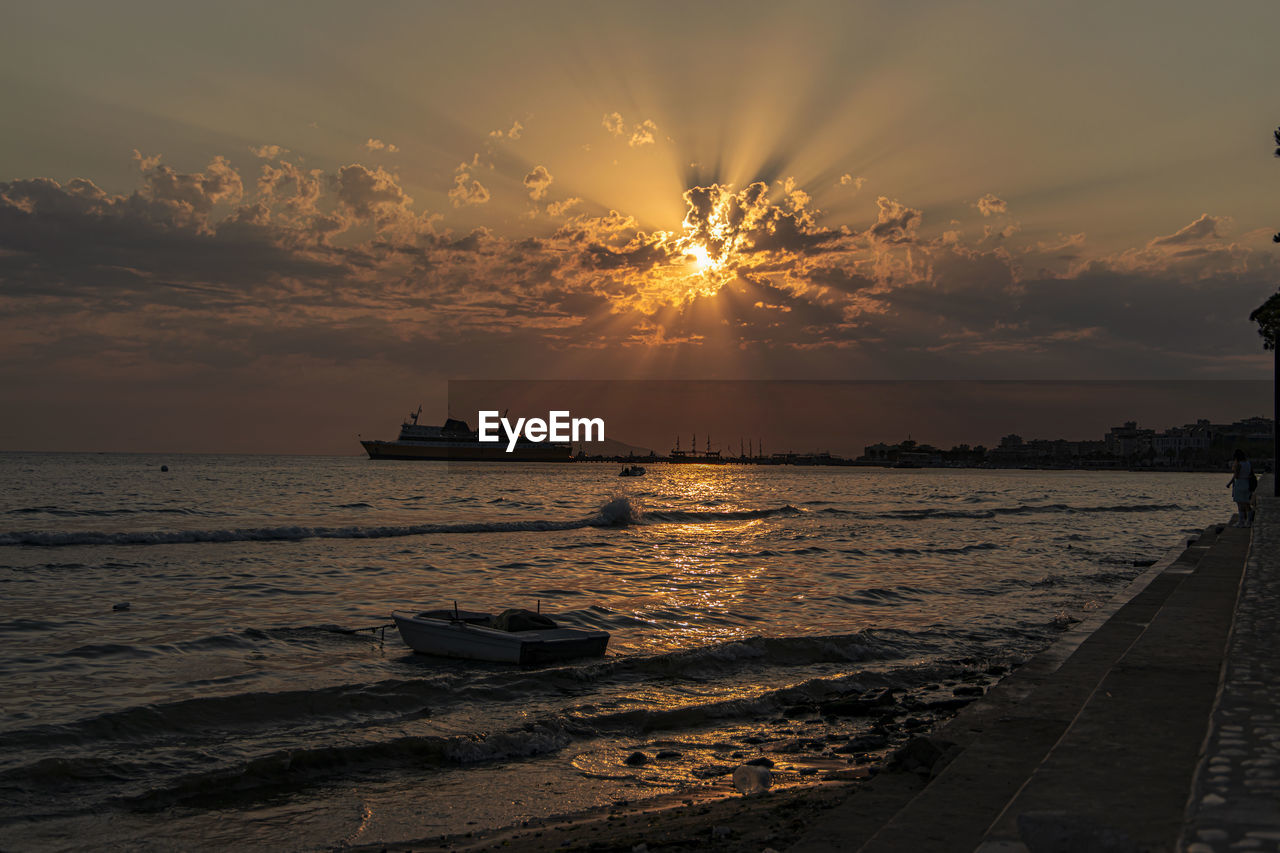 SCENIC VIEW OF SUNSET OVER SEA